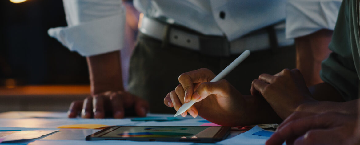 Group of Asia young creative people in smart casual wear discuss
