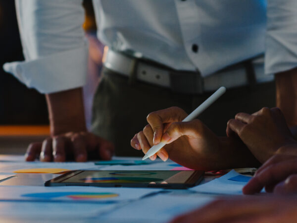 Group of Asia young creative people in smart casual wear discuss